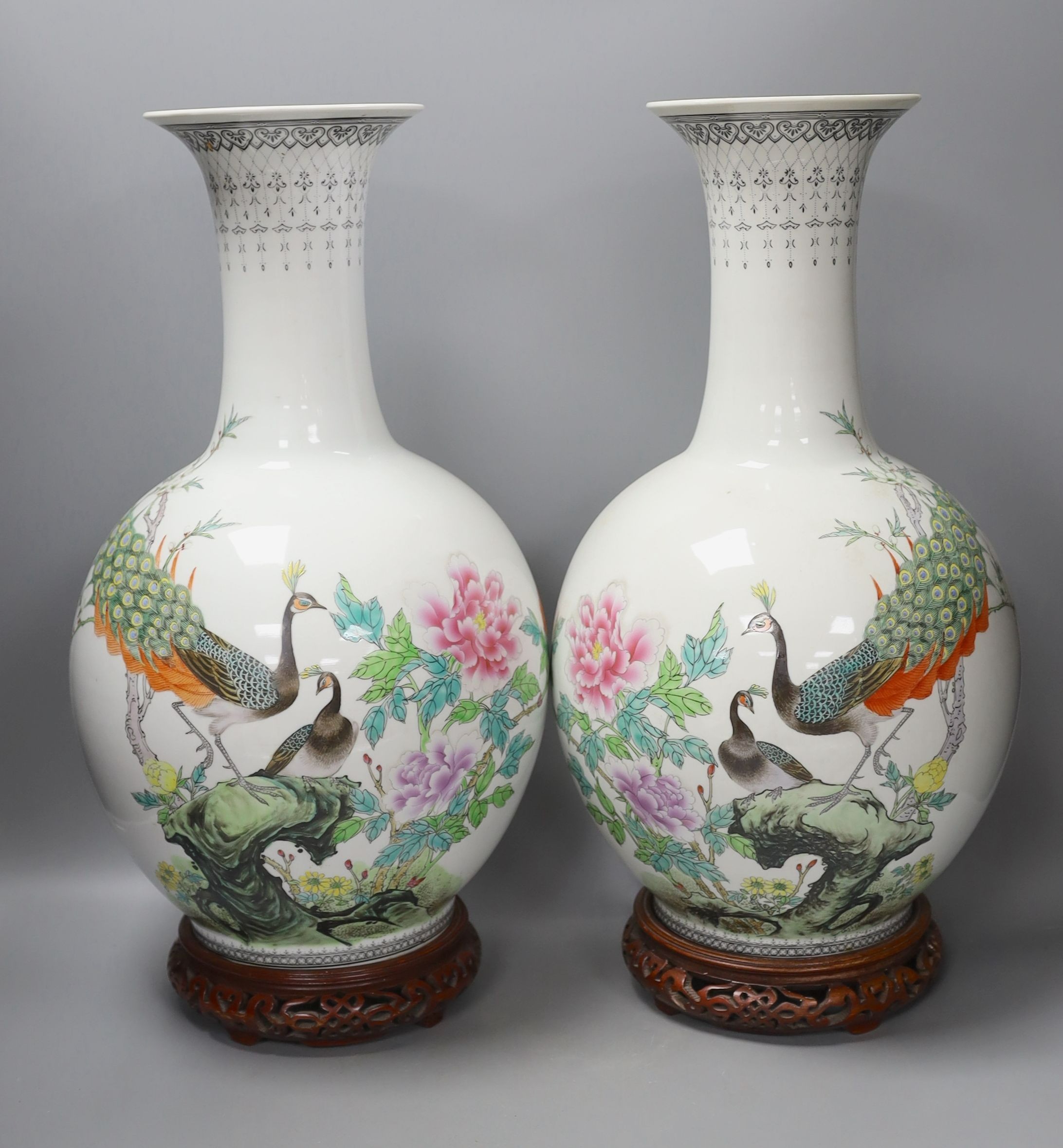 A pair of large Chinese famille rose peacock inscribed vases - 50cm tall